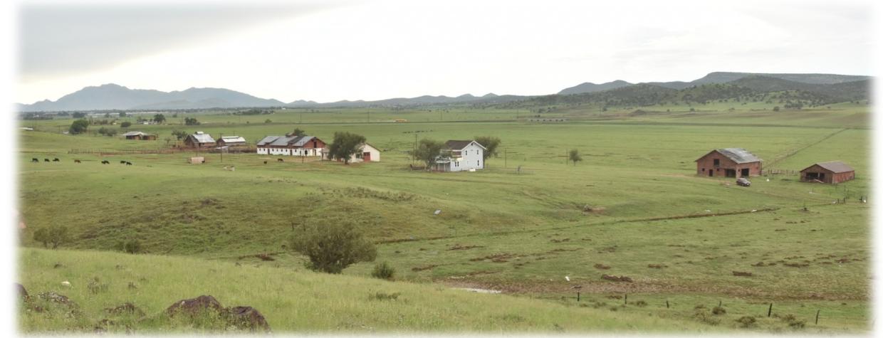 The historic Fred Harvey Farm sits on green fields near Chino Valley.