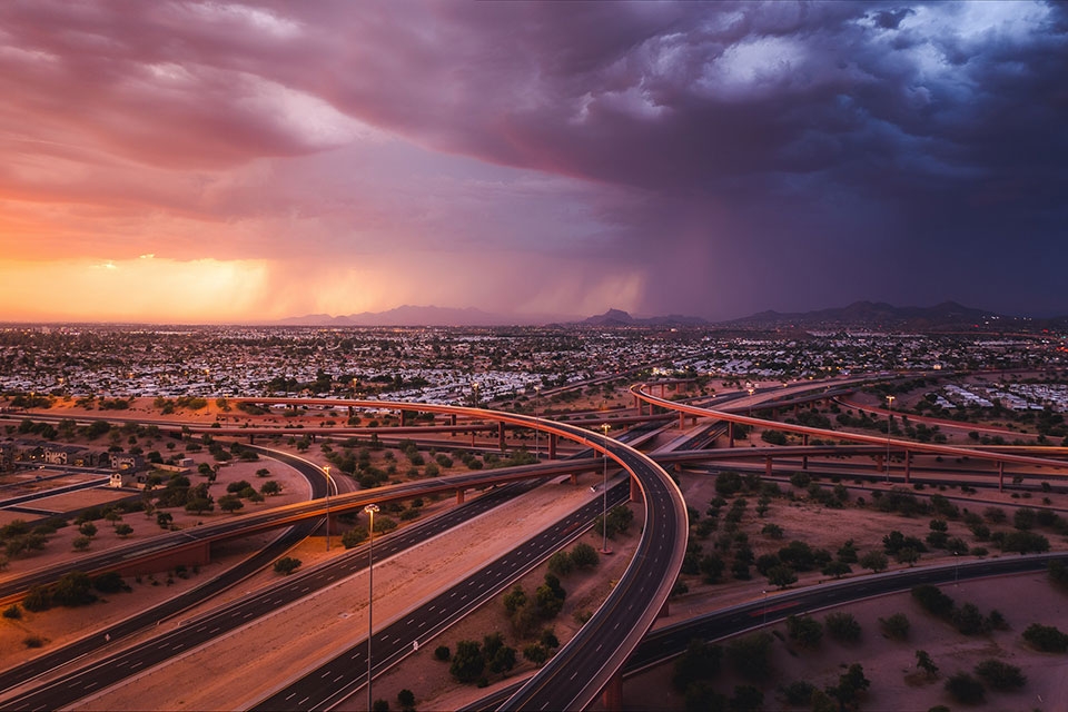 A highway interchange in the Phoenix area offers a striking view of a monsoon storm.