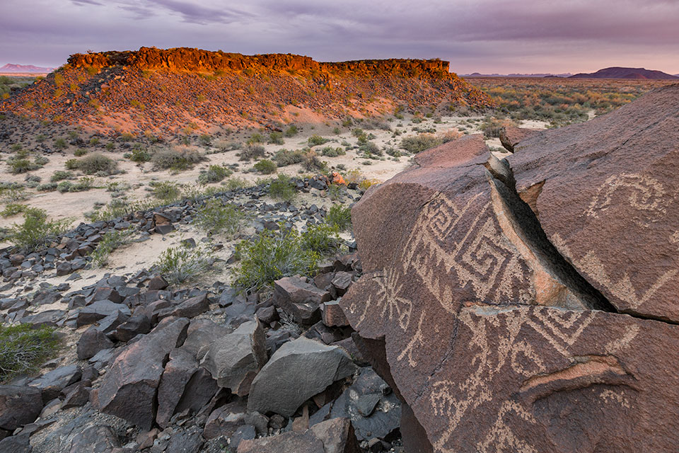 Petroglyphs decorate basalt outcrops at Sears Point, west of the city of Gila Bend. These works of art are among an estimated 100,000-plus ancient drawings along the Great Bend of the Gila. By Paul Gill