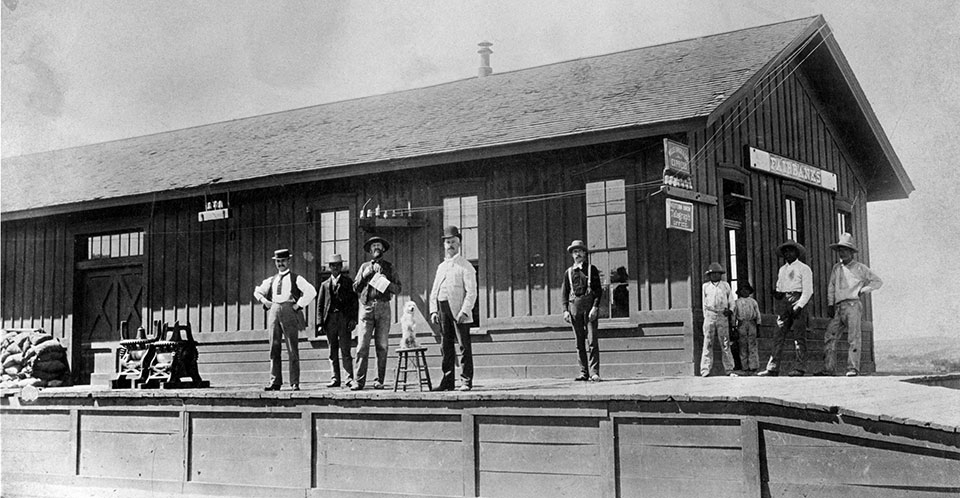 Passengers wait at the town’s railroad depot in an undated photo. | Arizona Historical Society