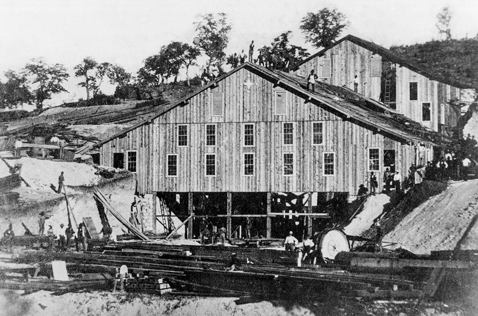 A mill at the Hermosa Mine is shown during its construction in the  late 1870s. By Arizona Historical Society