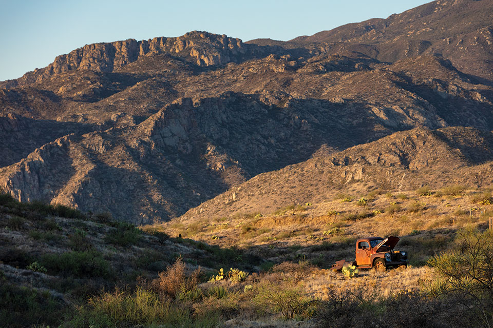 A rusted old truck punctuates a view of the Bradshaw Mountains near Cleator. The ghost town is little more than an hour’s drive from Phoenix, but it feels much more remote than that. By John Burcham