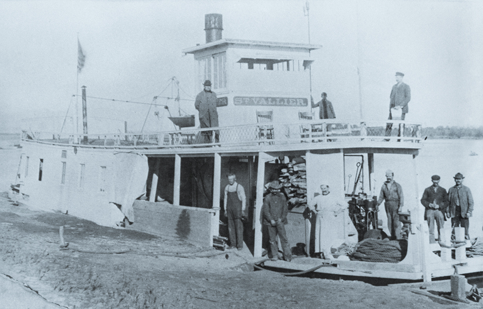 The crew of the steamer St. Vallier takes a break on the river somewhere above Yuma. Built by the Santa Ana Mining Co., the St. Vallier began operating around 1900. | THE HUNTINGTON LIBRARY