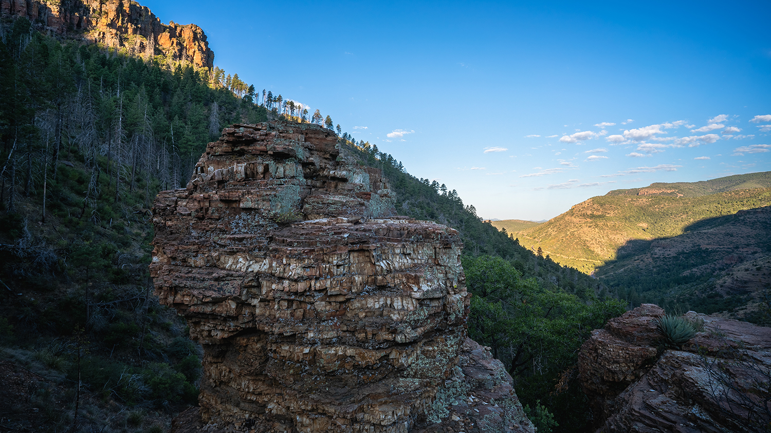 A strange rock overlooks a deep valley near the Parker Creek Trail in the Tonto National Forest. By Eric Mischke