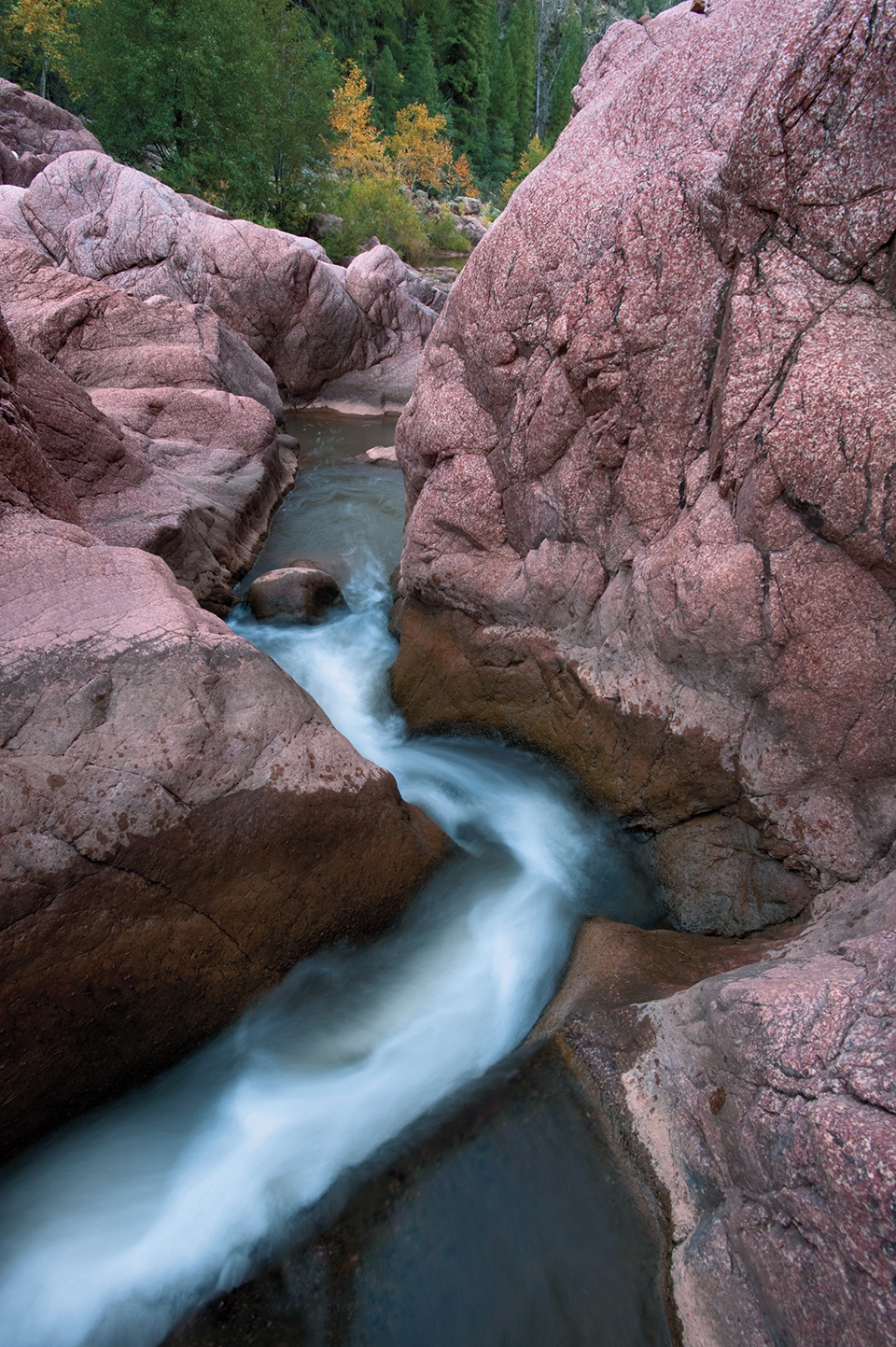 Tonto Creek cascades over pink granite below Bear Flat in the Hellsgate Wilderness. By Elias Butler