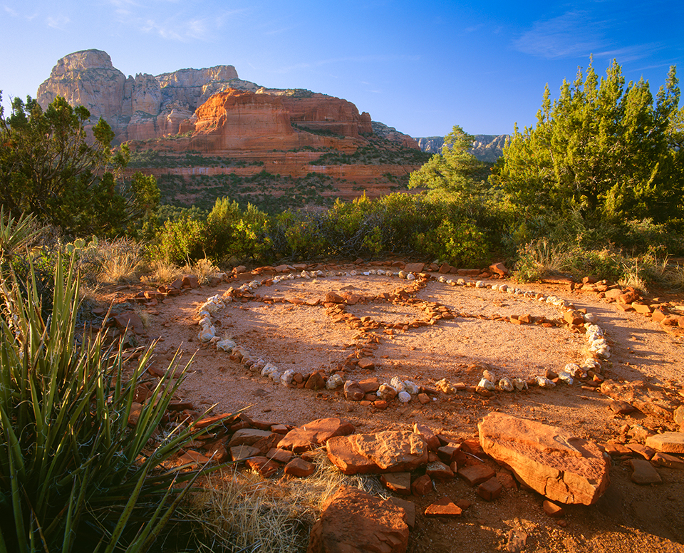 At sunrise, shadows fall on a medicine wheel near the buttes of the Red Rock-Secret Mountain Wilderness. Medicine wheels and other New Age practices are now prohibited by the Coconino National Forest. | George H.H. Huey