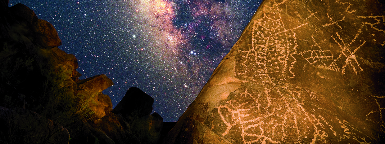 In this composite image, Hohokam rock art is illuminated against a Milky Way backdrop in Southern Arizona’s Picacho Mountains. The long swath of dots may symbolize the universe, along with other sky objects and serpents, which are thought to represent prayers being carried to the gods. | Frank Zullo