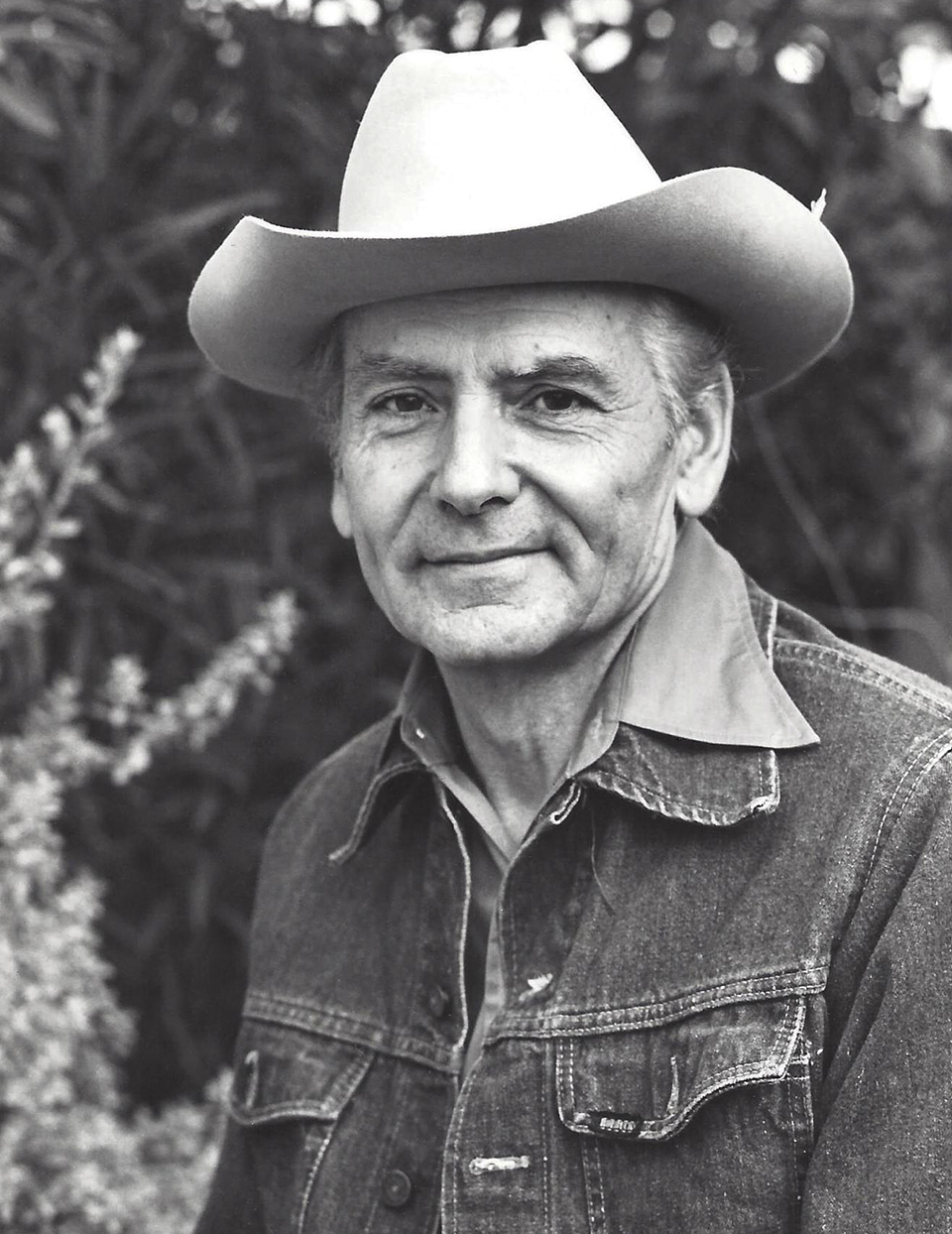 BW portrait of Allen C. Reed in denim jacket and cowboy hat. | COURTESY OF THE REED FAMILY 