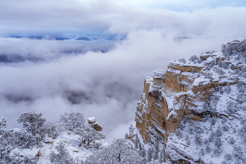 Clouds fill the Canyon during a winter storm, as seen from Maricopa Point, another South Rim overlook. The weather phenomenon seen here, known as an inversion, occurs when warm air above the Canyon traps cooler air below the rim. | Laurence Parent