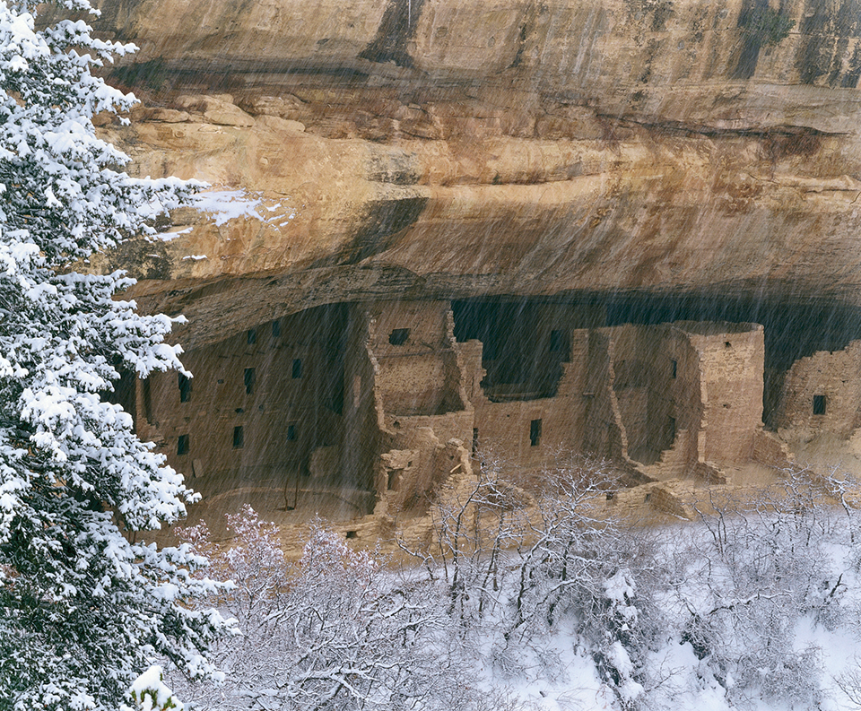 Spruce Tree House A protective cliff overhang shelters the ancient structure in Mesa Verde National Park, Colorado. The remote cliff dwelling, built in the 13th century, once housed about 80 Puebloan residents. | George H.H. Huey