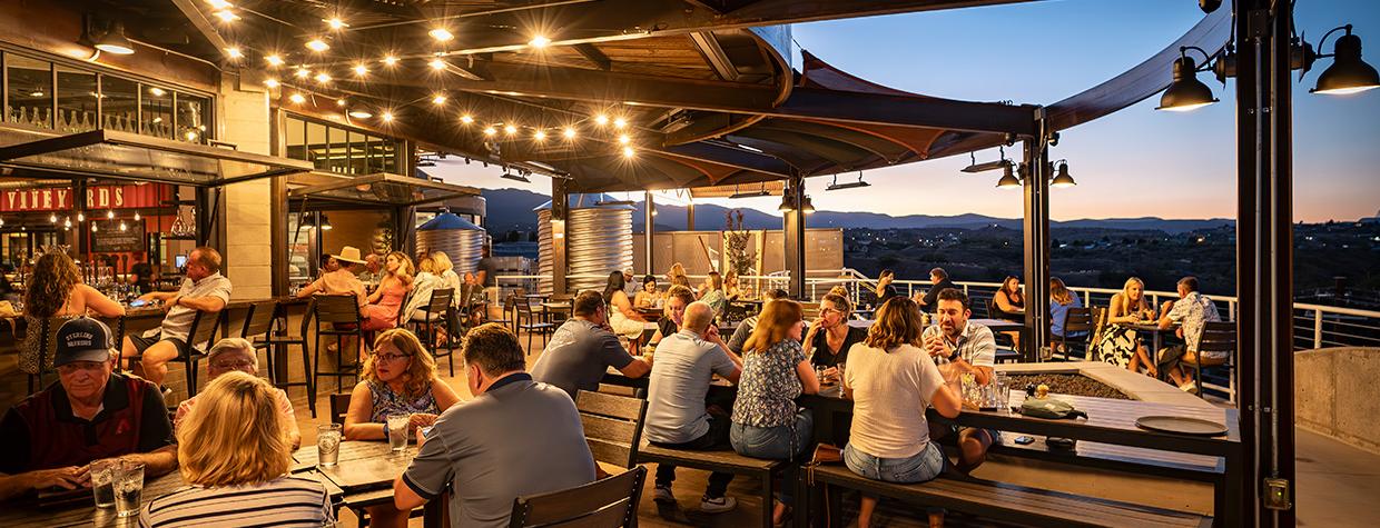 Patrons enjoy patio dining with view of Verde Valley at sunset. By Dawn Kish