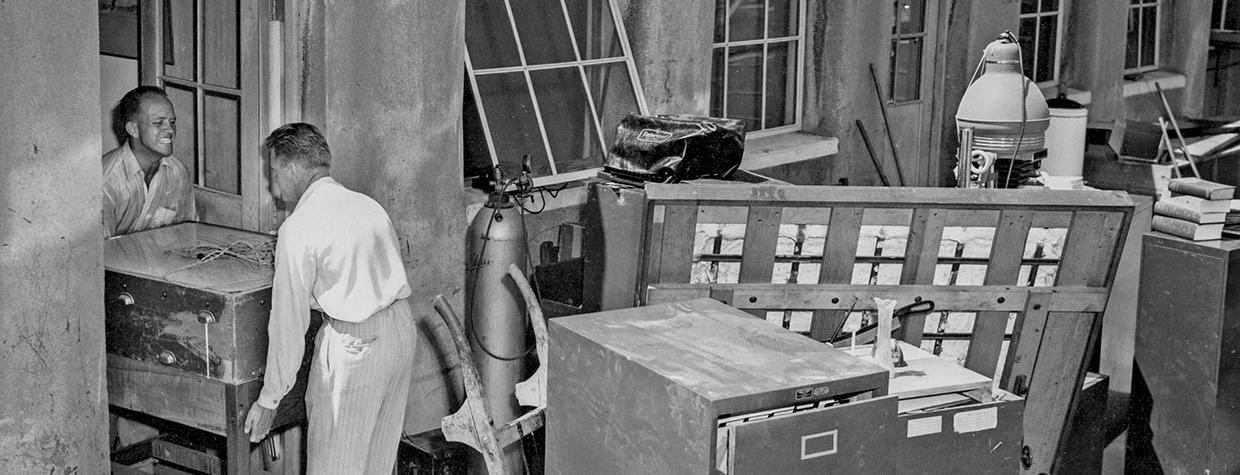 Raymond Carlson (left) helps move furniture from our first office.