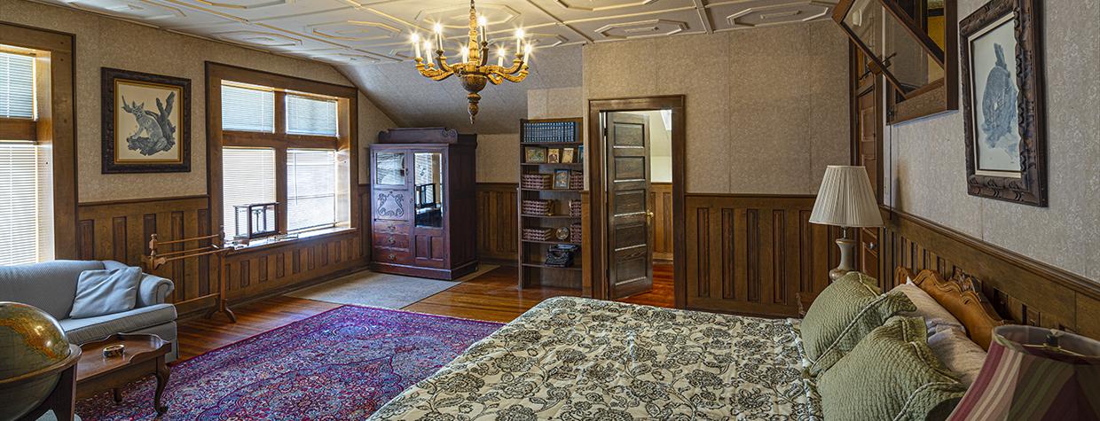 The interior of a room at Calumet & Arizona Guest House features with eclectic antique furnishings. By Steven Meckler