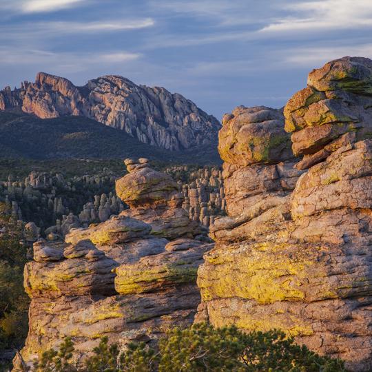 Cochise Head looms over the hoodoos along Chiricahua National Monument’s Heart of Rocks Loop at sunset. | Laurence Parent