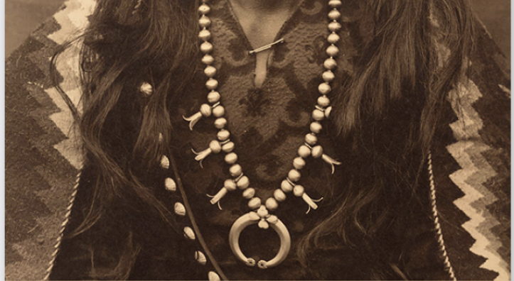 A book cover shows Navajo "Gunshooter" in a sepia toned image. He's wearing tradition clothing and a large squash blossom necklace.