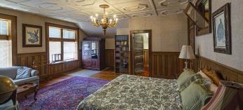 The interior of a room at Calumet & Arizona Guest House features with eclectic antique furnishings. By Steven Meckler
